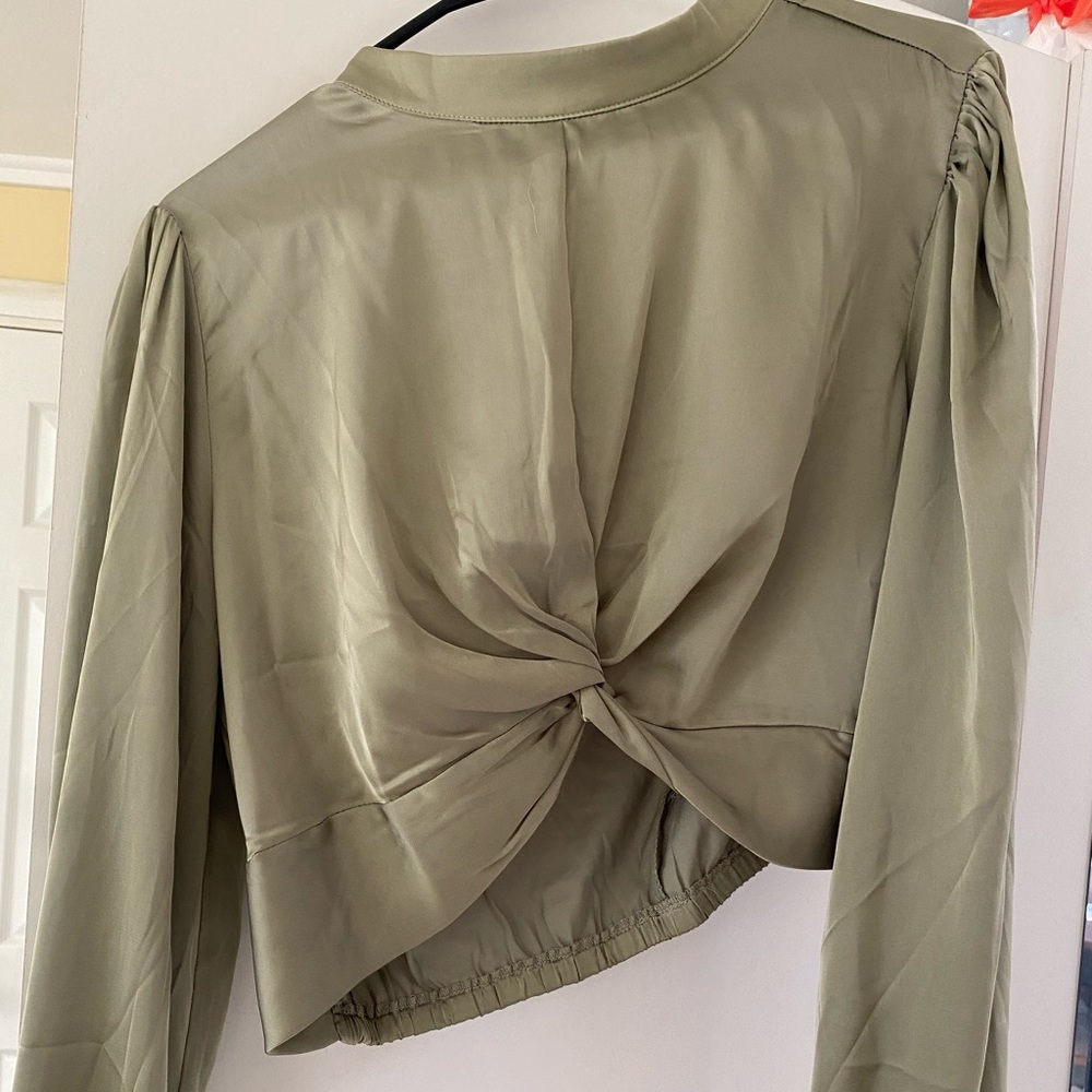Green long sleeve top.